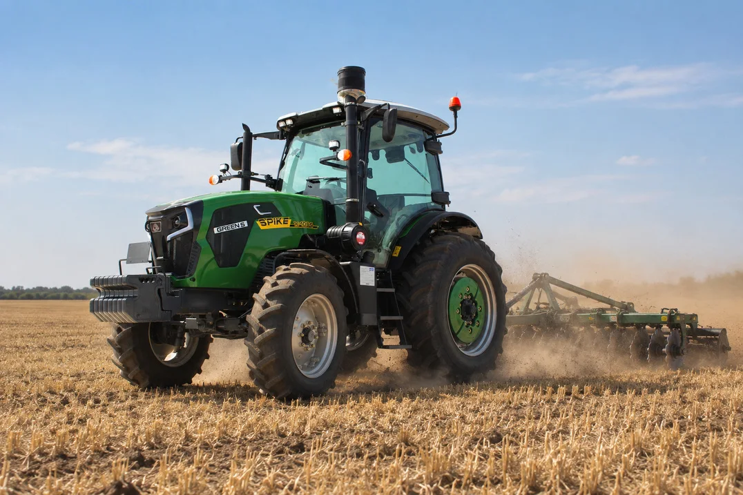 SPIKE TK 1054 Common Rail 105 hp tractor working in a field with a disc harrow